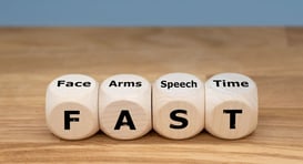 wooden dice spelling out F-A-S-T