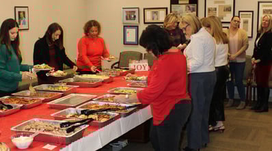 Beekley holiday luncheon, 2024. Associates lined up to enjoy a bountiful buffet.