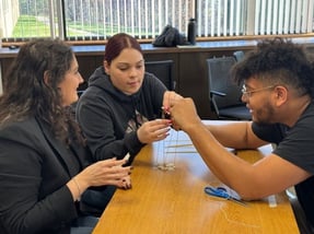 A group of Beekley employees working together on a game