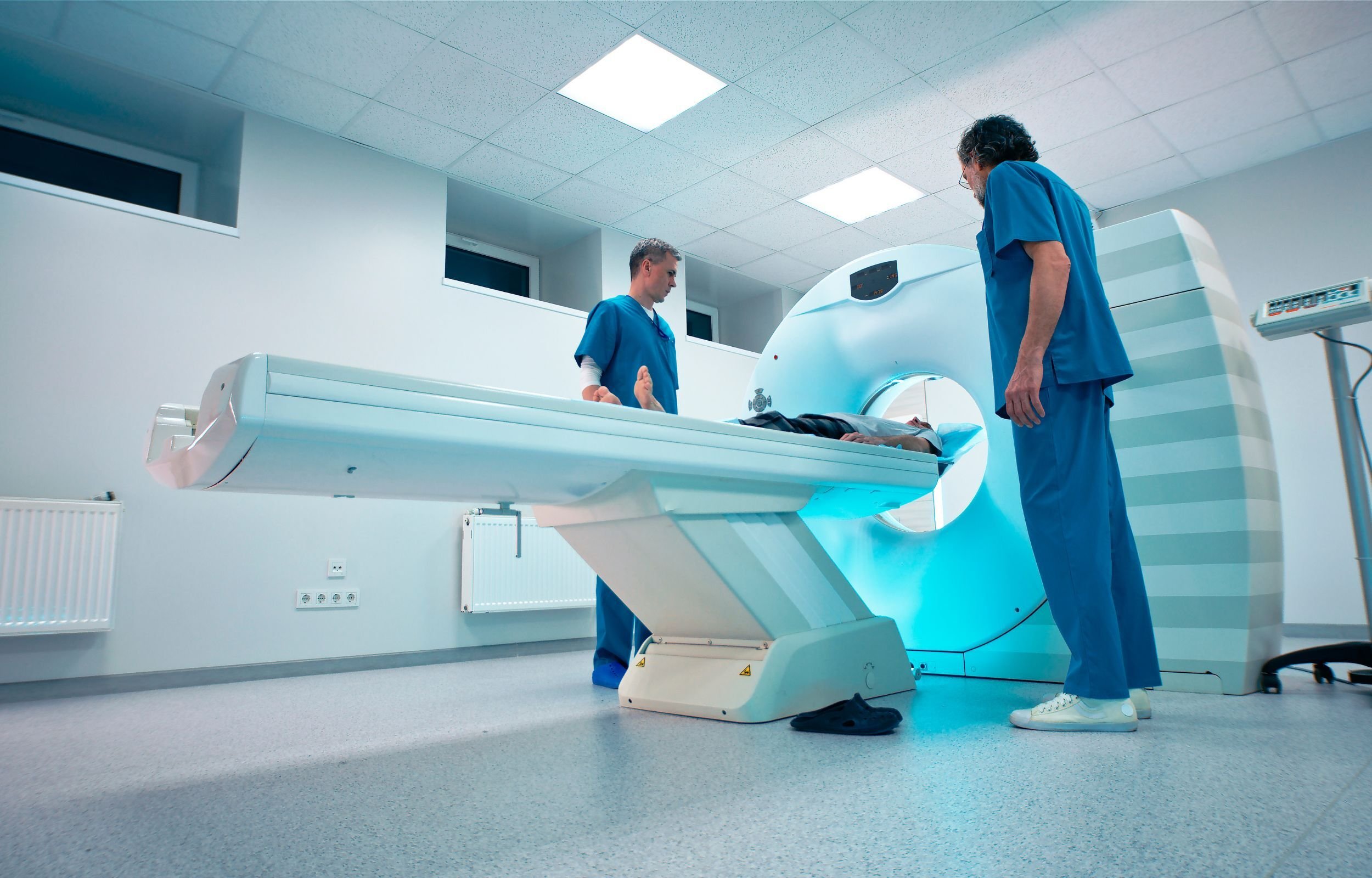 Technologists setting a patient up for a CT simulation