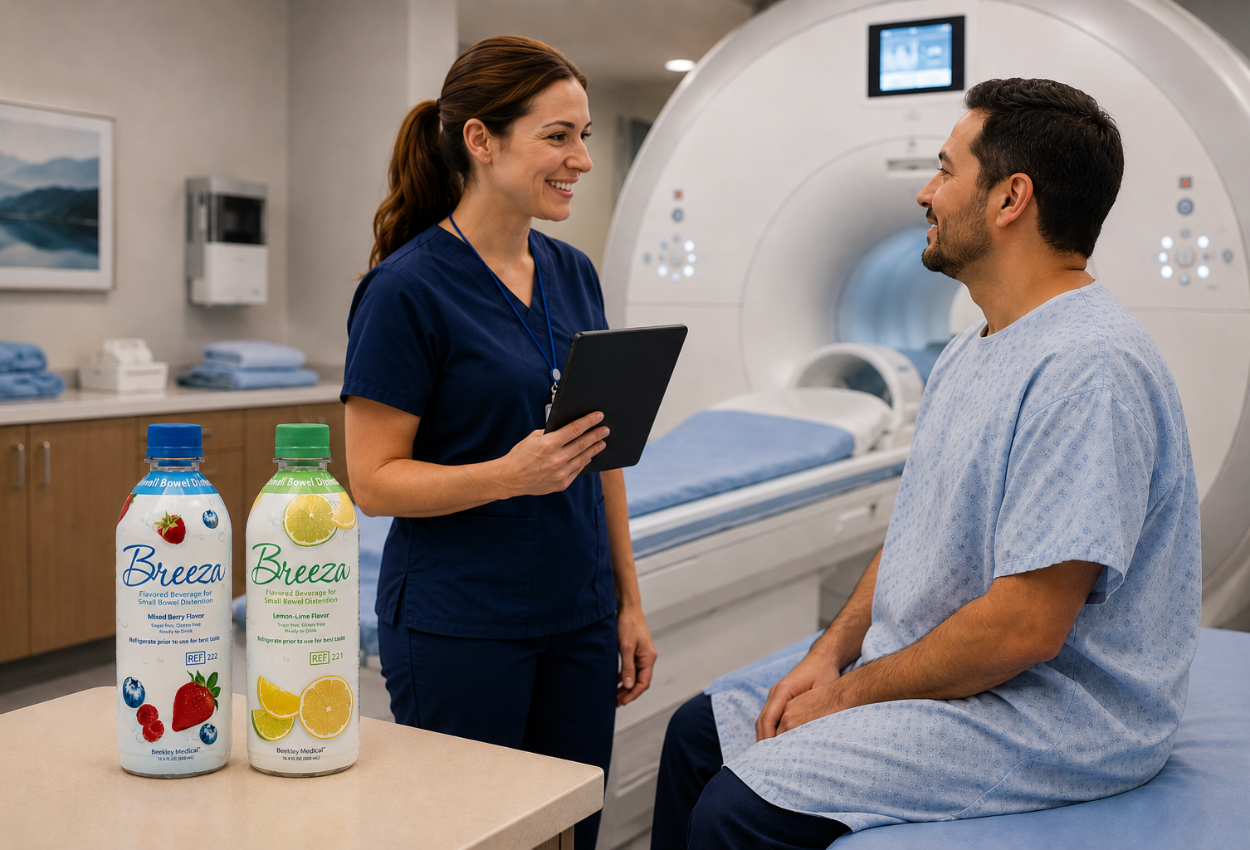female tech talking a male patient about to start prep, with two bottles of Breeza small bowel distention on a table near them