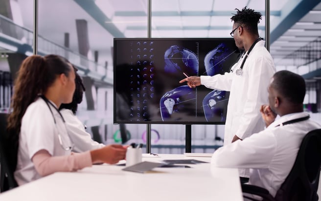 Doctors reviewing MR scans on a knee