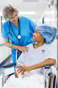 A nurse working with a patient wearing an Elequil Aromatab