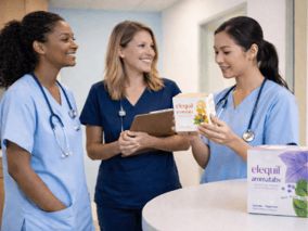 nurses-looking-at-elequil-box
