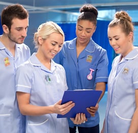 A group of nurses wearing Elequil Aromatabs