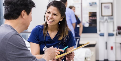 A nurse smiling at a patient