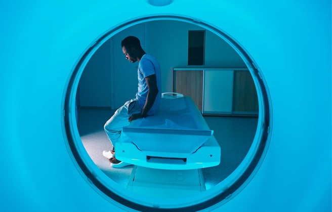 A patient sitting on a CT machine
