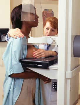 A patient with a TomoSPOT Skin Marker on her breast for a mammogram