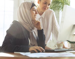 young muslim ladies at computer