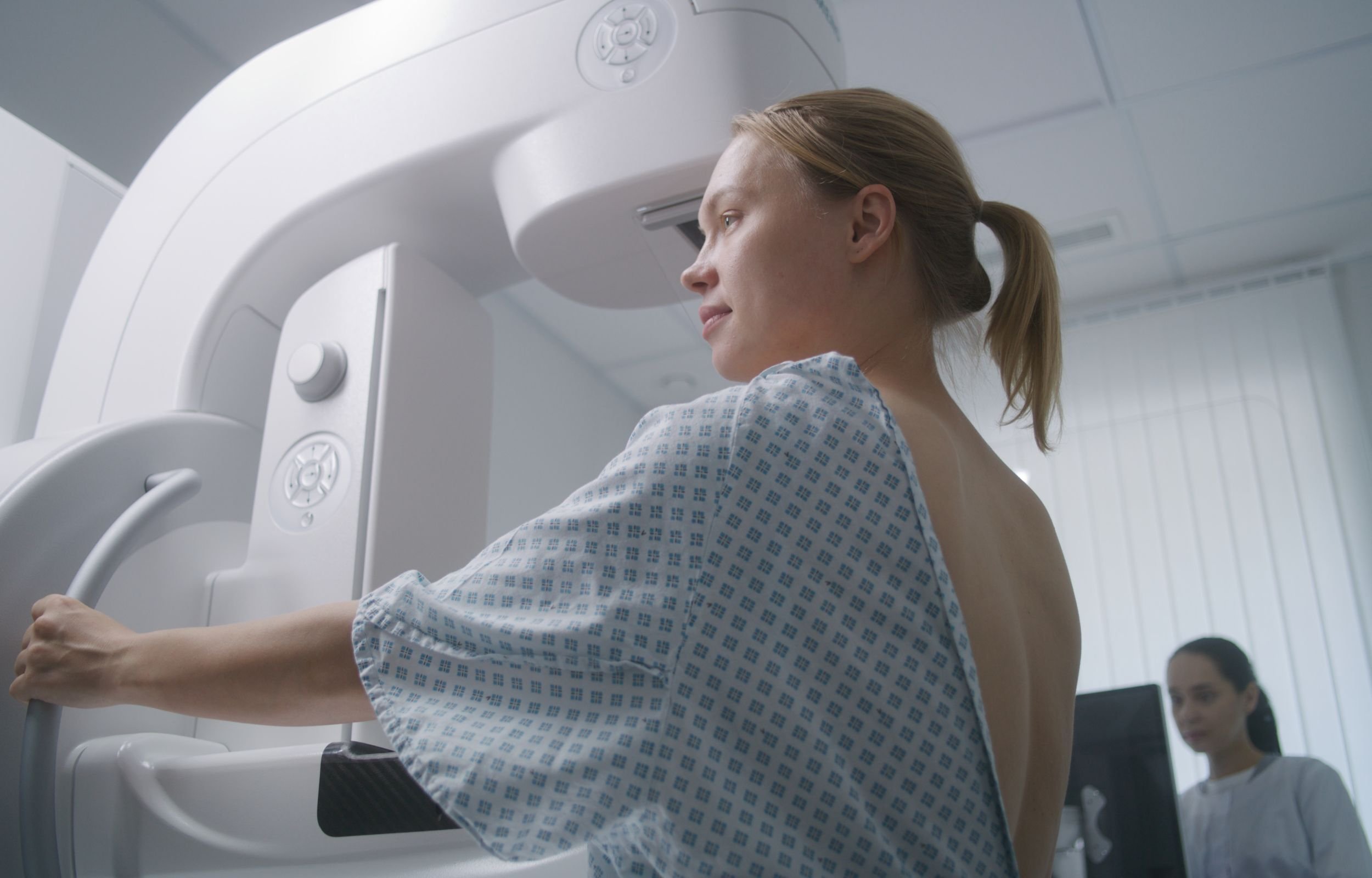 A woman getting a mammogram