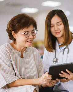 A doctor discussing something with a patient personally
