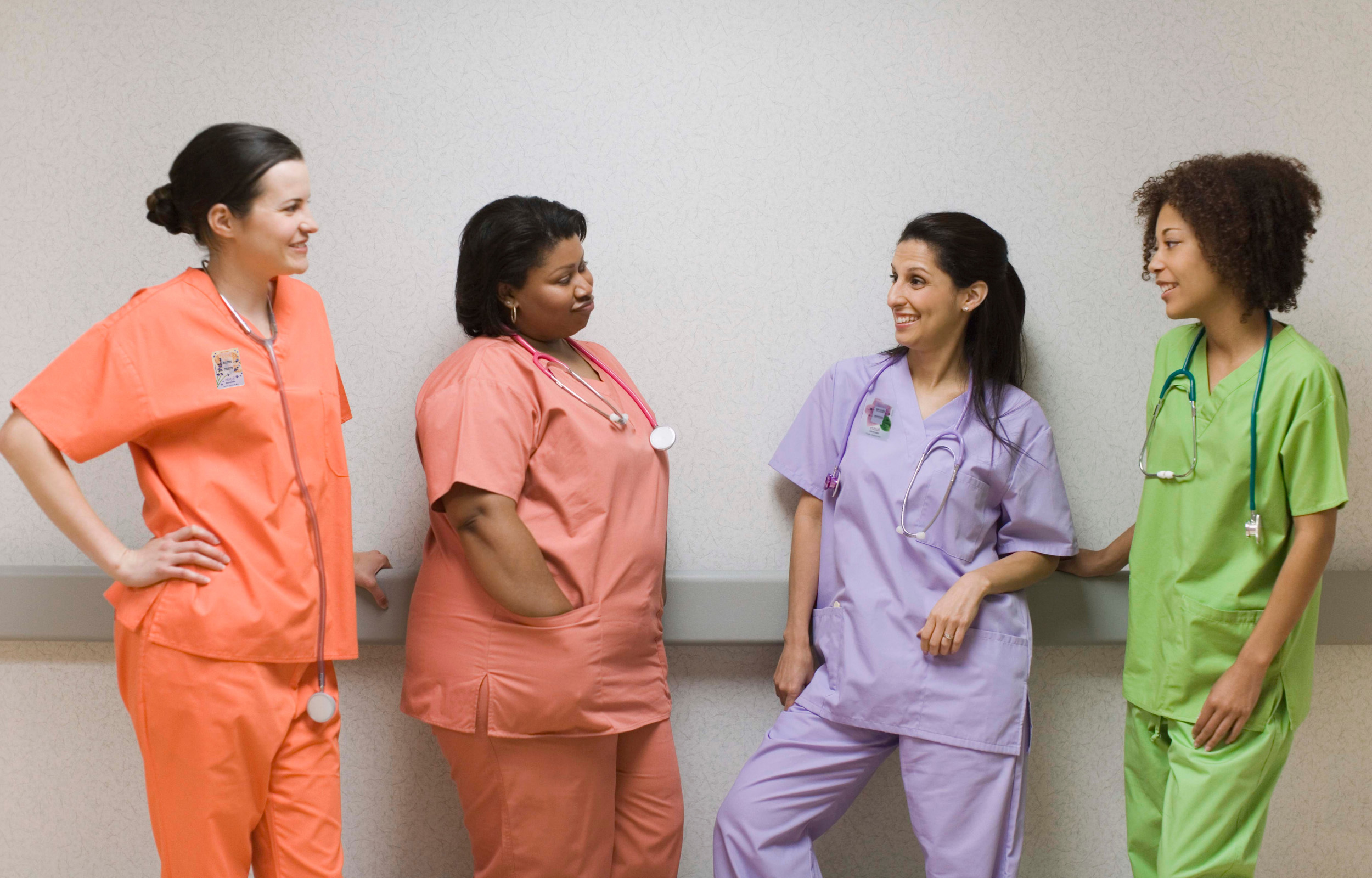 A group of nurses wearing Elequil Aromatabs