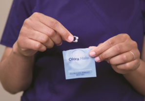 nurse removing an olora halo from the pouch
