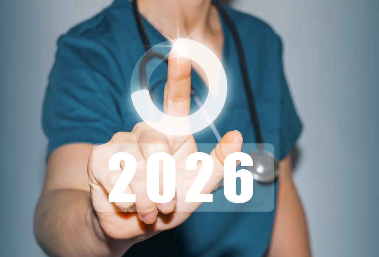 female medical worker in green scrubs hitting a power button over the year 2026