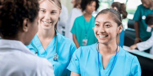 Nurses smiling and shaking hands