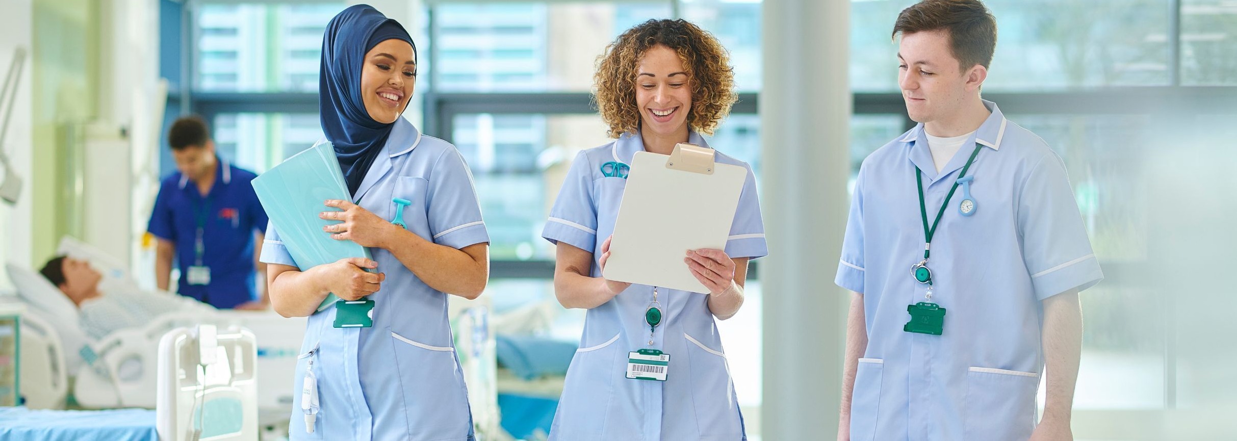 Three nursing students walking side by side