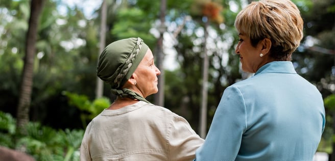 A patient and friend walking with their backs turned.