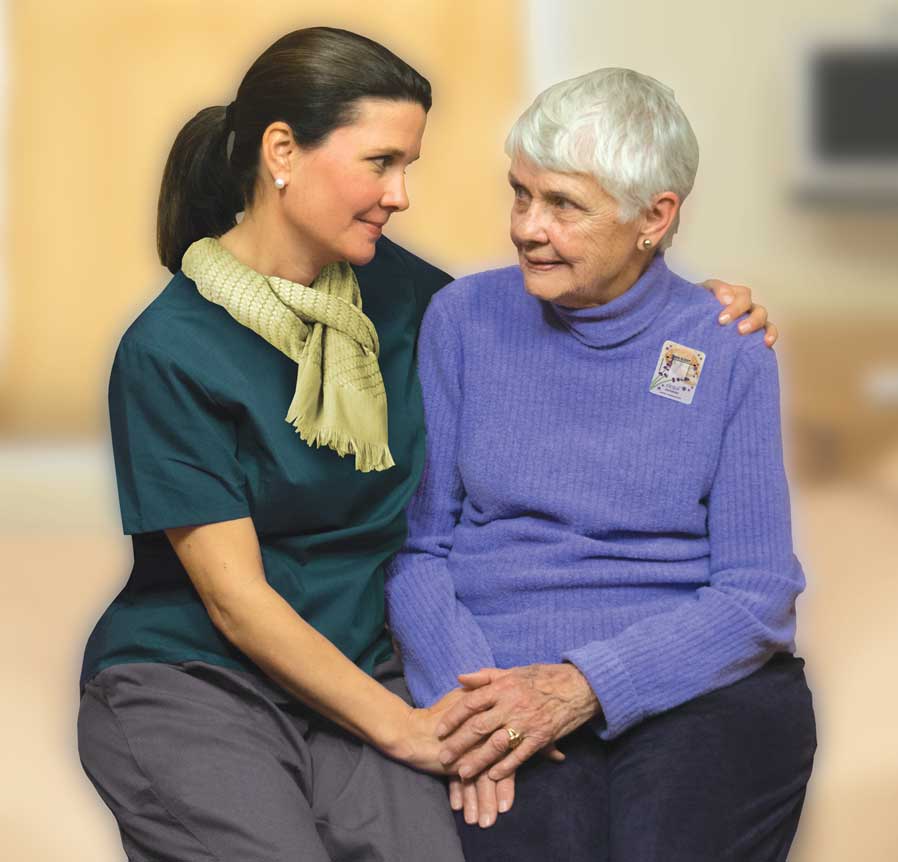 comforting elderly woman