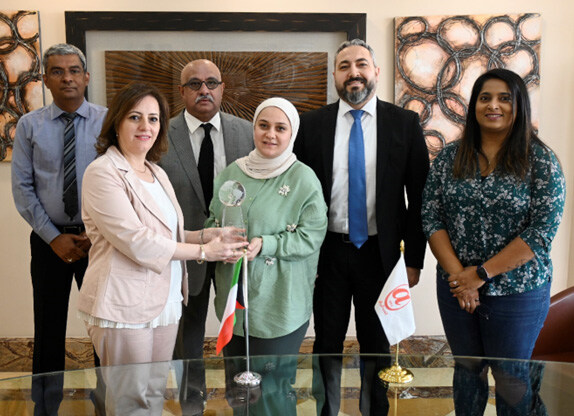 Ashfar & Co, Ltd team photo with award